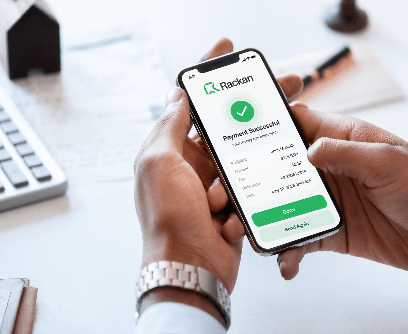 A Rackan payment confirmation on a phone, showing the recipient, amount and fee